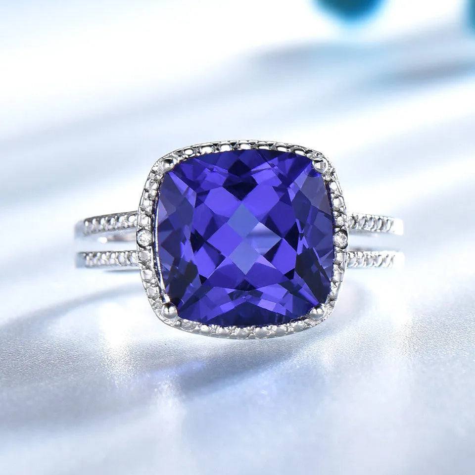 Blue tanzanite stone set in sterling silver women's ring with alloy accessory