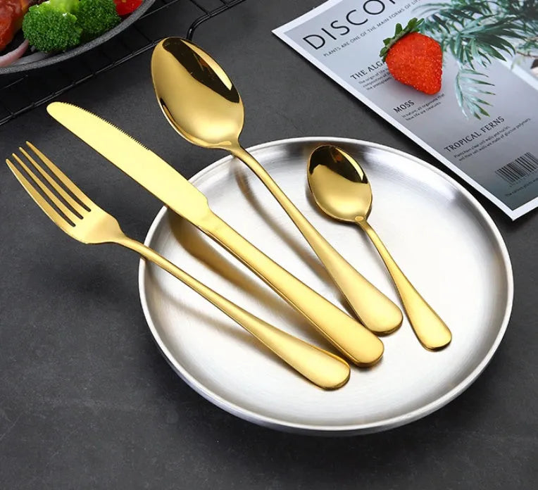 24 piece stainless steel cutlery set showing knives, forks and spoons in various colour finishes with one-piece moulding construction
