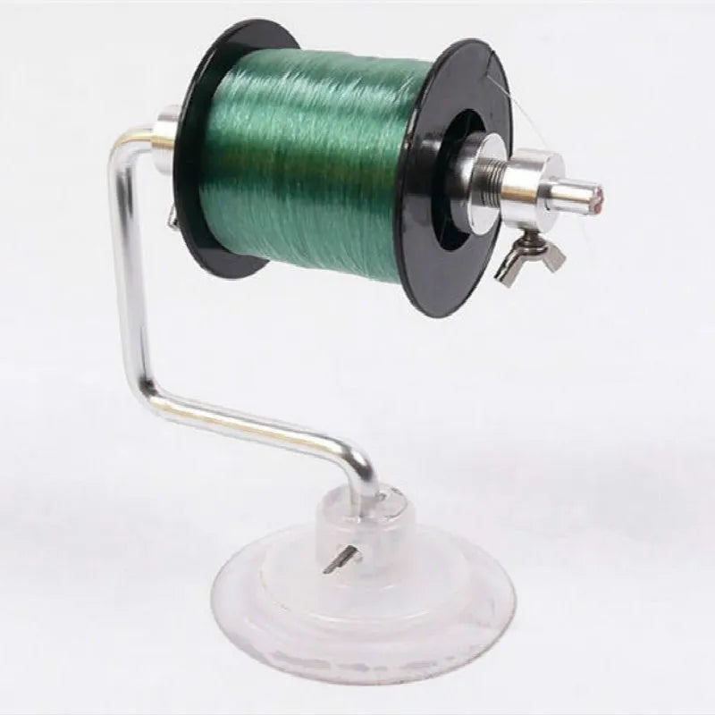 Silver aluminium fishing line spooler with suction cup base, adjustable tensioner, and anti-twist spool holder