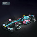 Mechanical F1 racing building blocks car in blue and pink with small plastic particles assembled on a surface