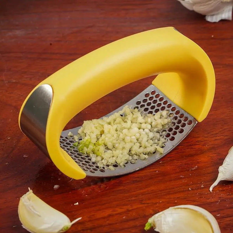 Stainless steel manual garlic press with ergonomic non-slip handle in assorted colours