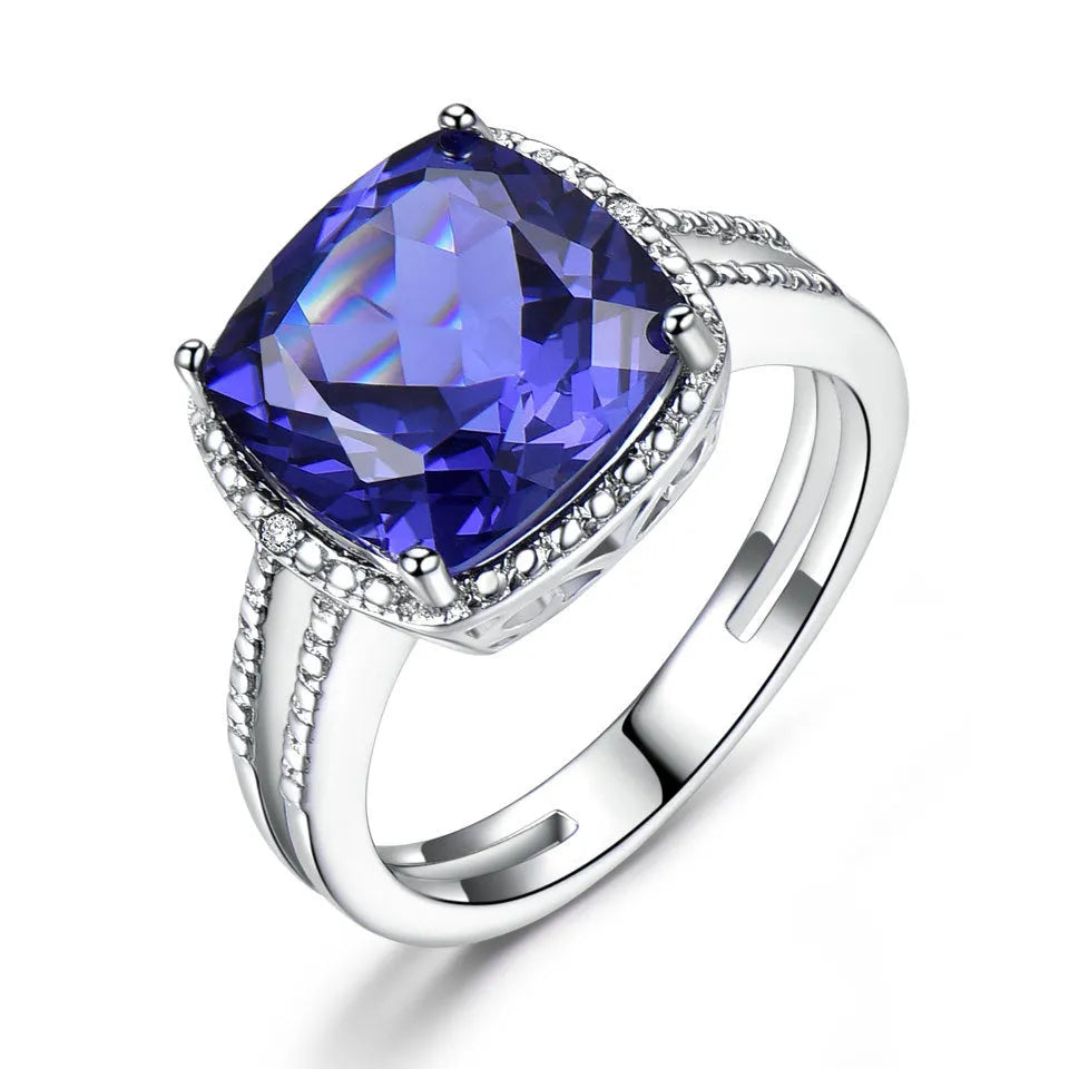 Blue tanzanite stone set in sterling silver women's ring with alloy accessory