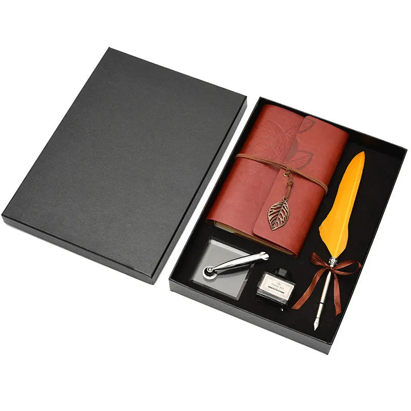 Feather dip pen gift set with natural quill, copper pen, ink, wax seal, acrylic stand and antique book in a box.