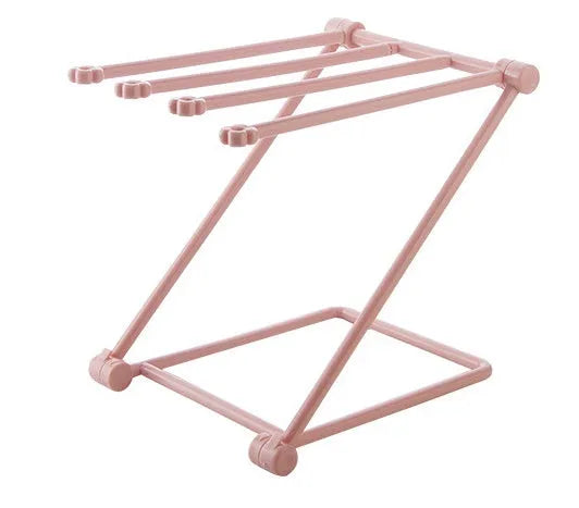 Foldable plastic dishcloth shelf organiser in light blue mounted on wall