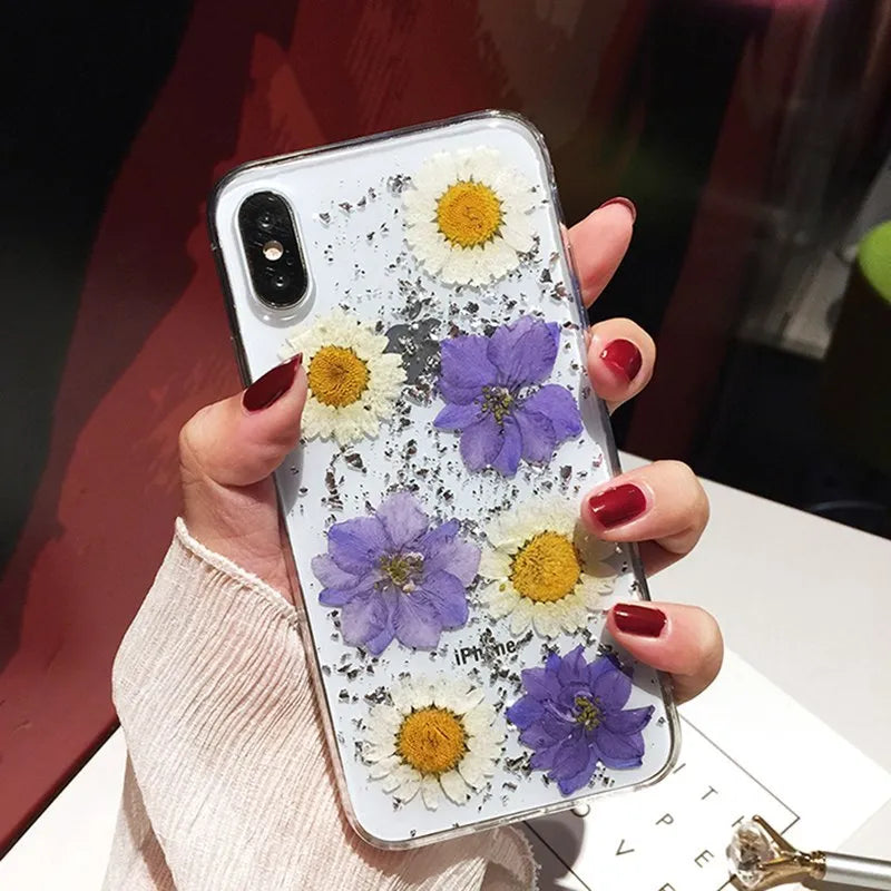 Qianliyao handmade clear TPU iPhone case with pink dried flowers encased in epoxy resin on the back.