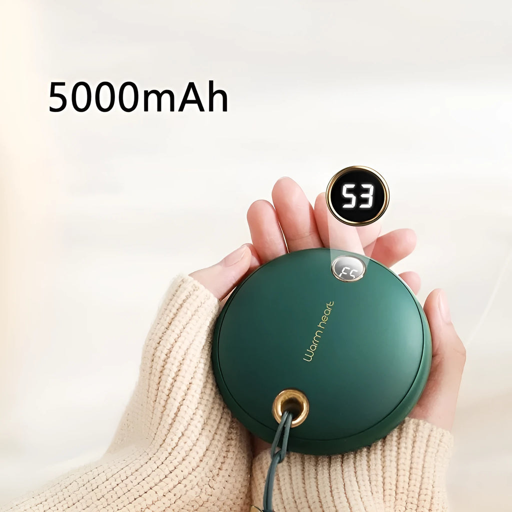 Green, pink, or white square 5000mAh hand warmer power bank with digital display next to charging cable.