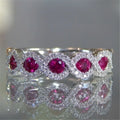 Micro-set ruby and green zircon ring in alloy, shown in green and gules with US size 5 to 12 chart