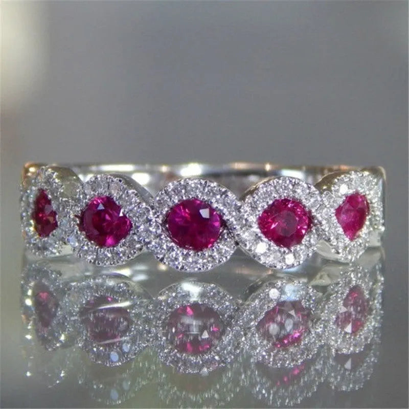 Micro-set ruby and green zircon ring in alloy, shown in green and gules with US size 5 to 12 chart