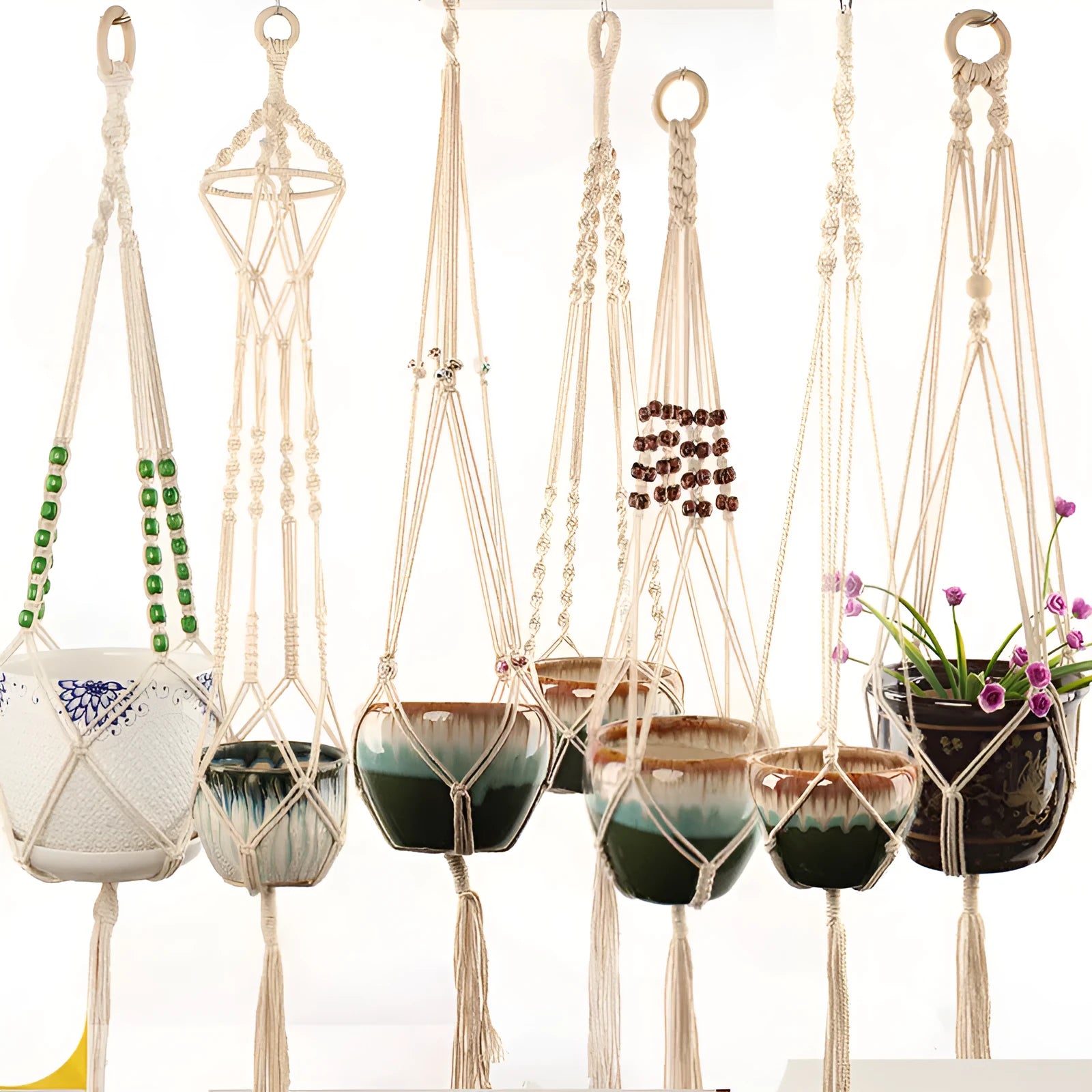 Woven wire plant hanger bracket with cotton rope, shown in a rustic style suitable for wall mounting.