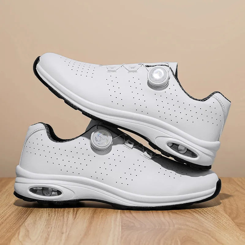 Low top black and white mesh casual shoes with cross shoulder straps and a composite sole.