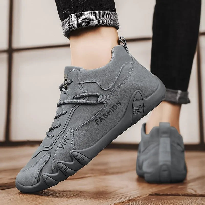 Men's grey low-top slip-on casual shoes with synthetic leather upper and rubber sole