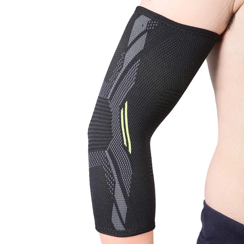 Black elbow support compression sleeve with anti-slip technical knit design on a neutral background