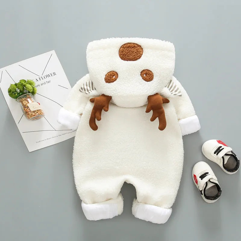 Baby wearing a long-sleeved khaki romper with lace-up strap closure on the front.