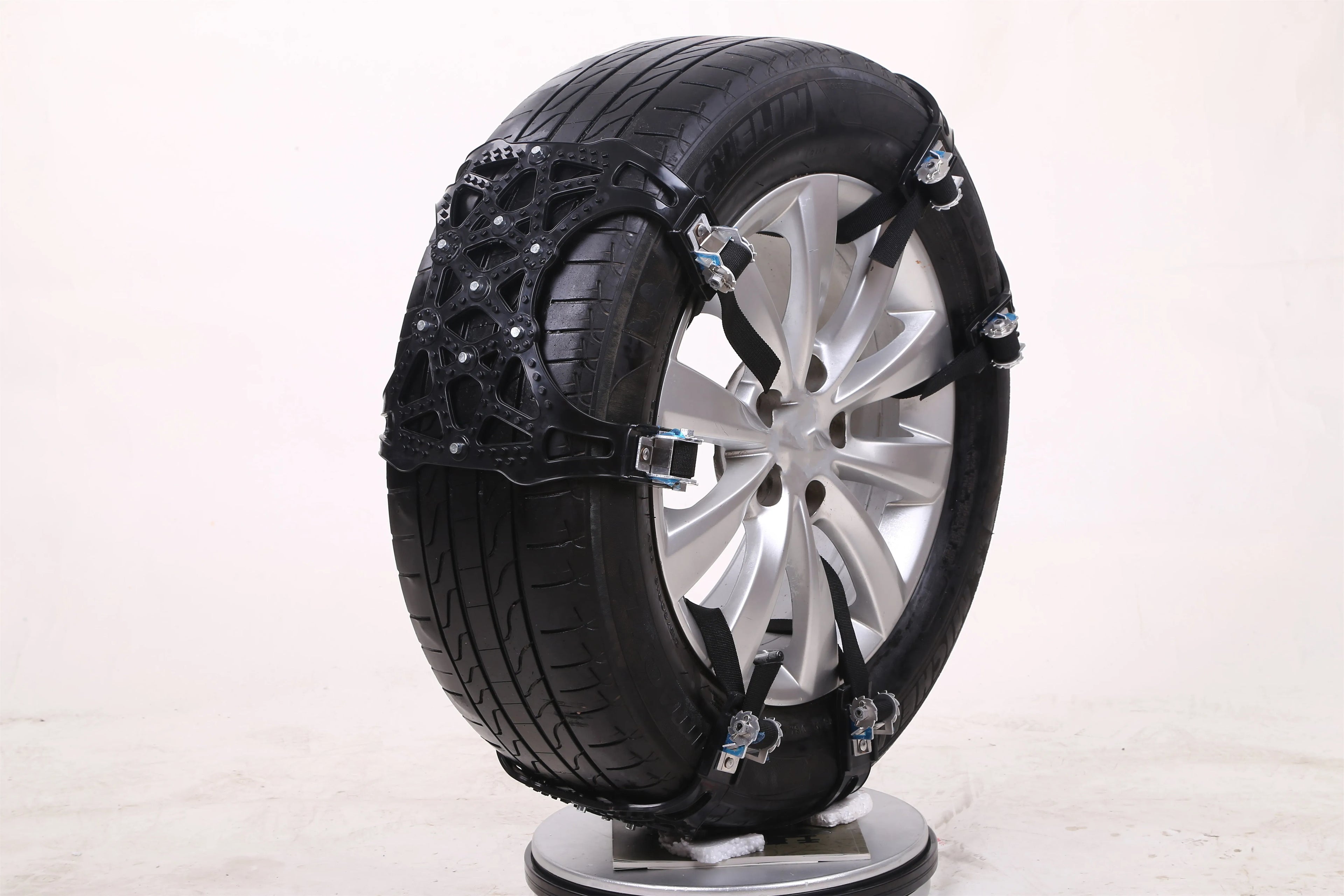 Yellow universal snow chain made from widened thickened TPU with steel nails for non-slip winter traction