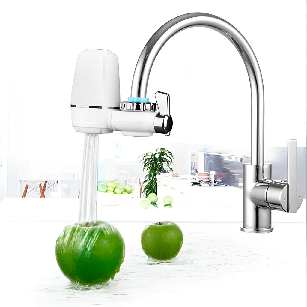 White plastic faucet water purifier with ceramic filter cartridge mounted on kitchen tap