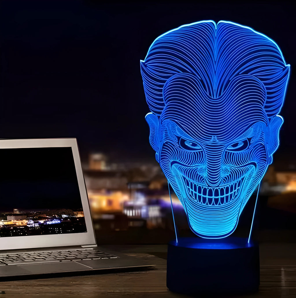 A 3D acrylic LED lamp emitting a gradient of colours, shown with its square base and remote control.