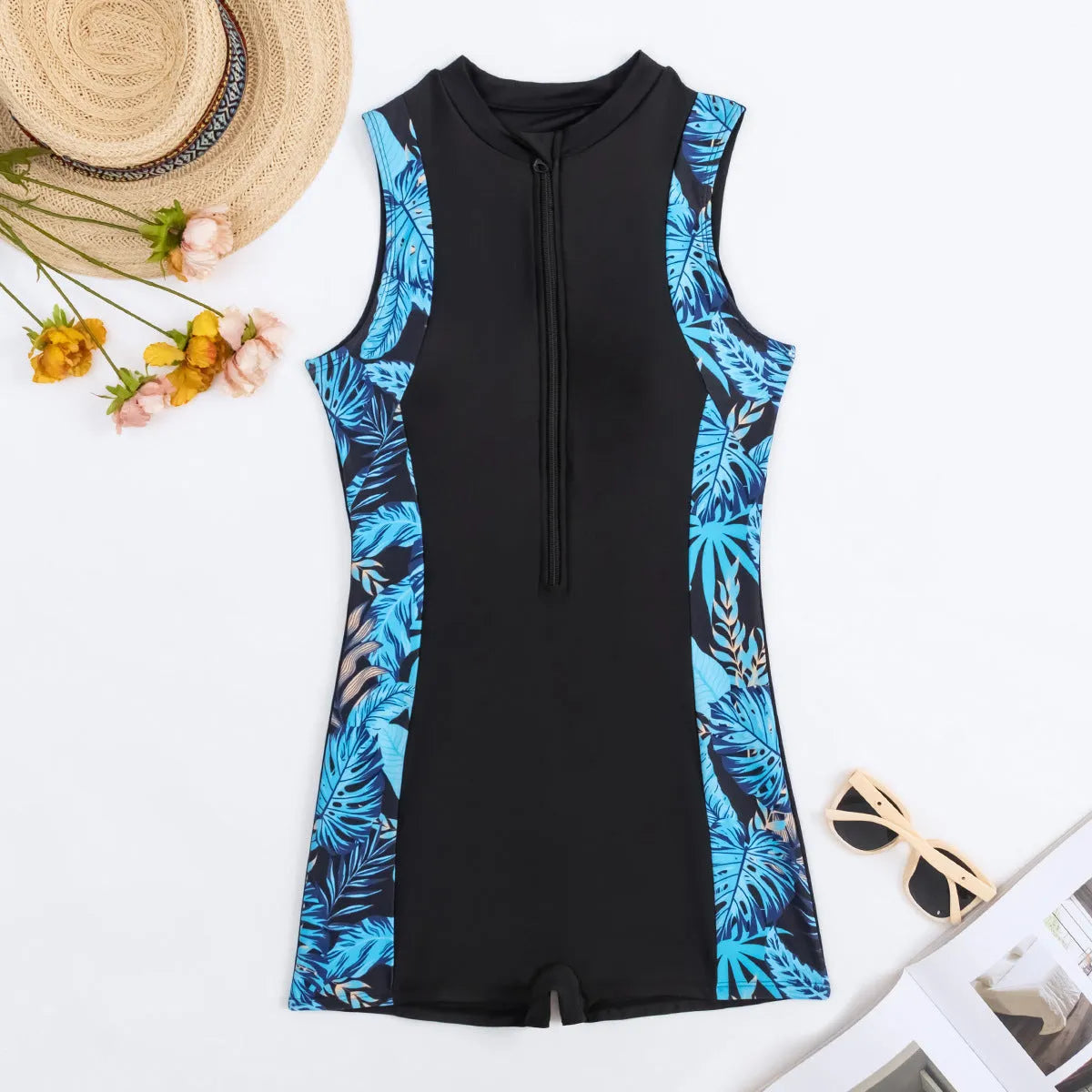 Black one-piece women's swimsuit with shorts in polyester and spandex, conservative solid colour design