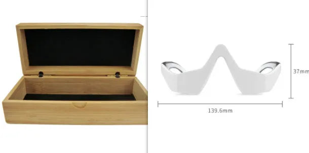 Pink and white 3D micro-current eye massager with glasses-style design on a stand.