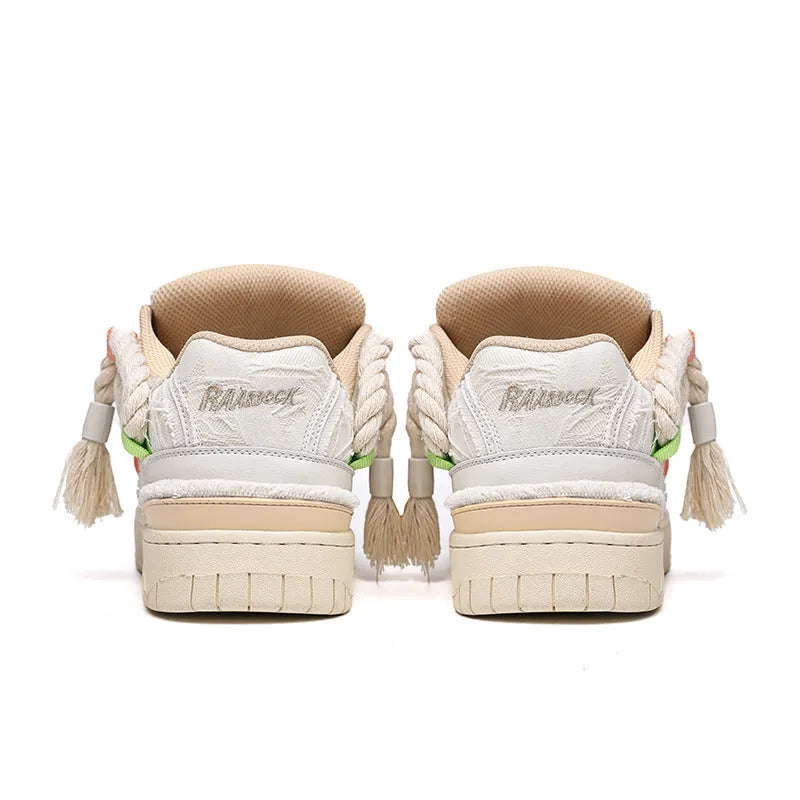 Creamy white retro low-top skateboard shoes with a platform sole and lace-up fastening.