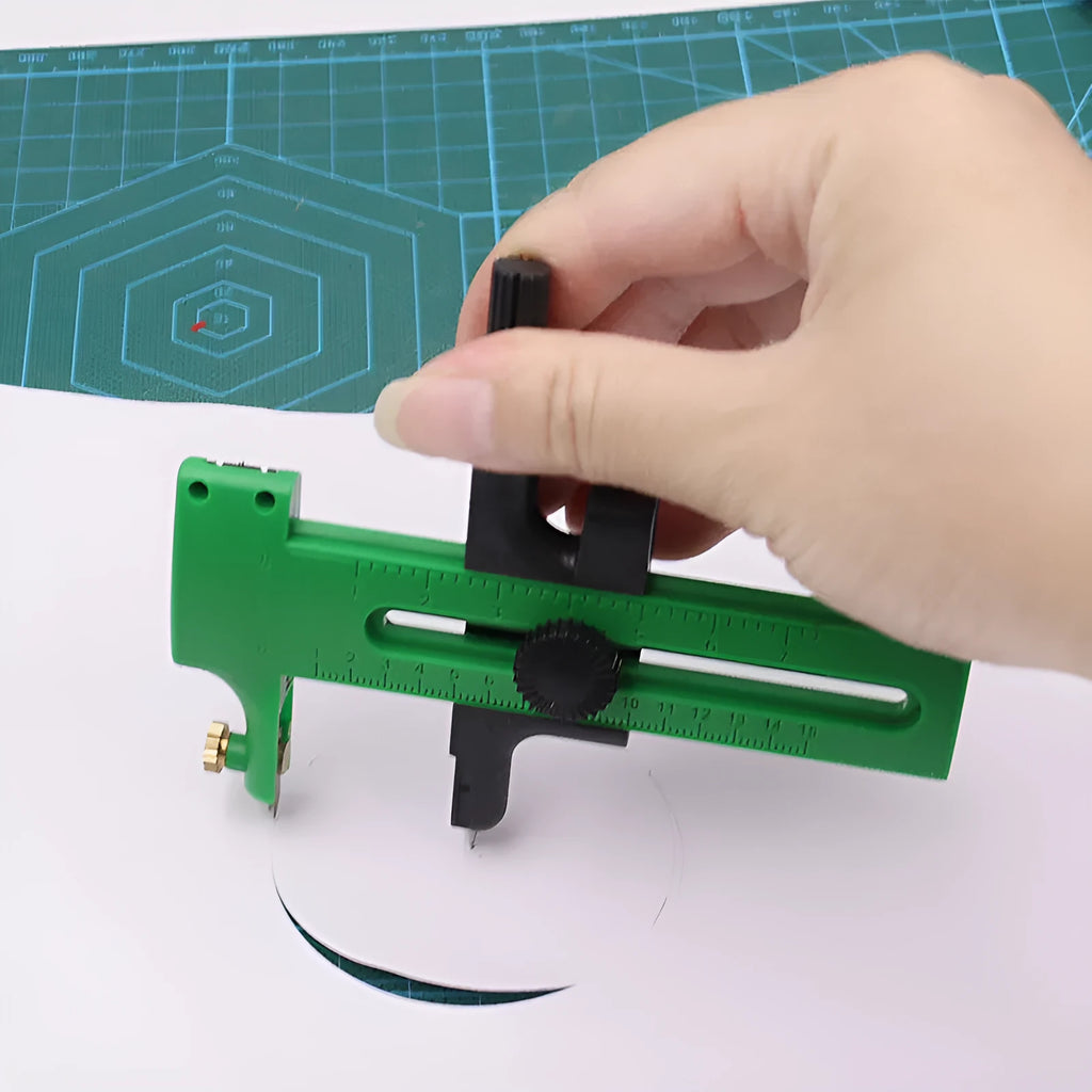 Small circular rail knife with plastic body and metal accessories for paper, cloth, and model cutting in blue