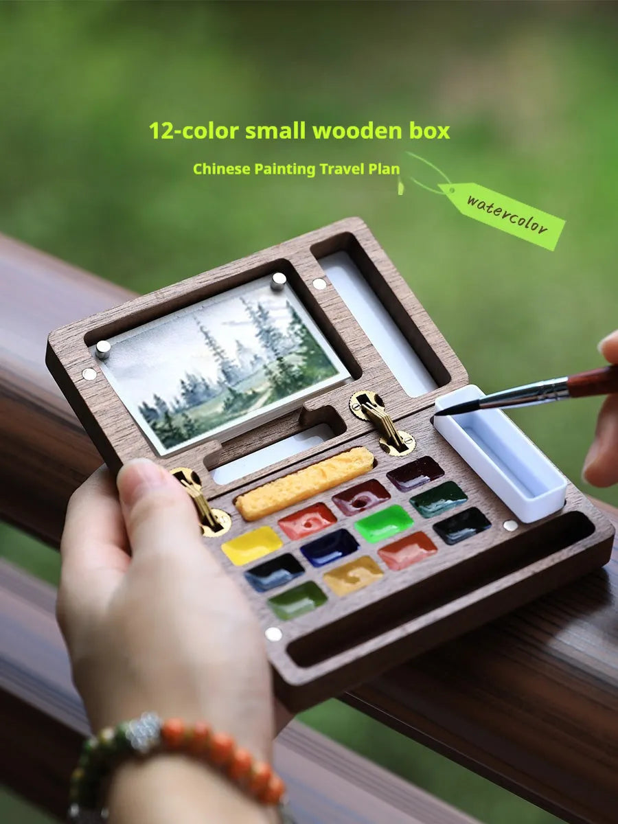 Mini walnut wood watercolour paint box for artist pigment sets.