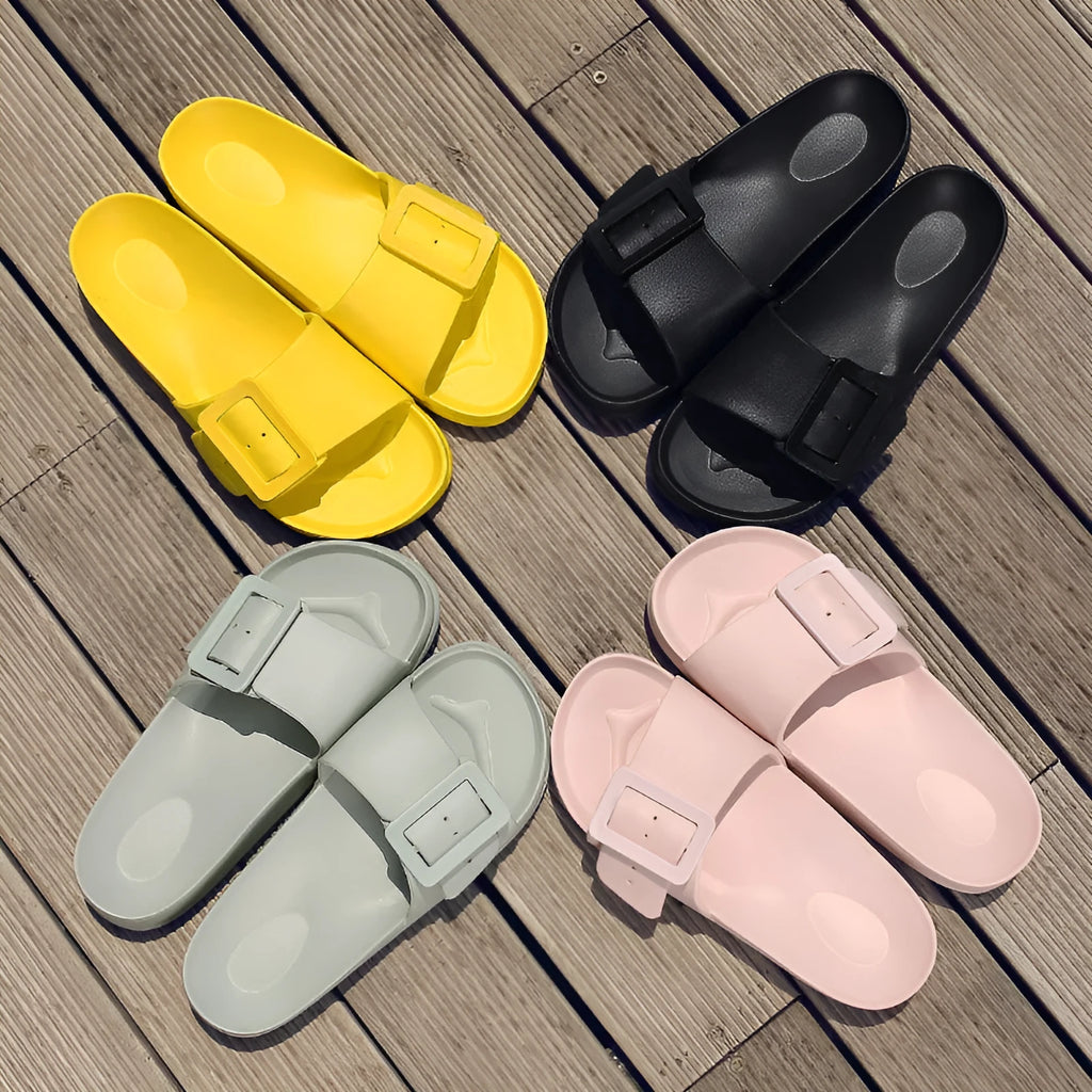 Women's grey blue flip-flop slippers with a soft EVA sole and a silver single buckle.