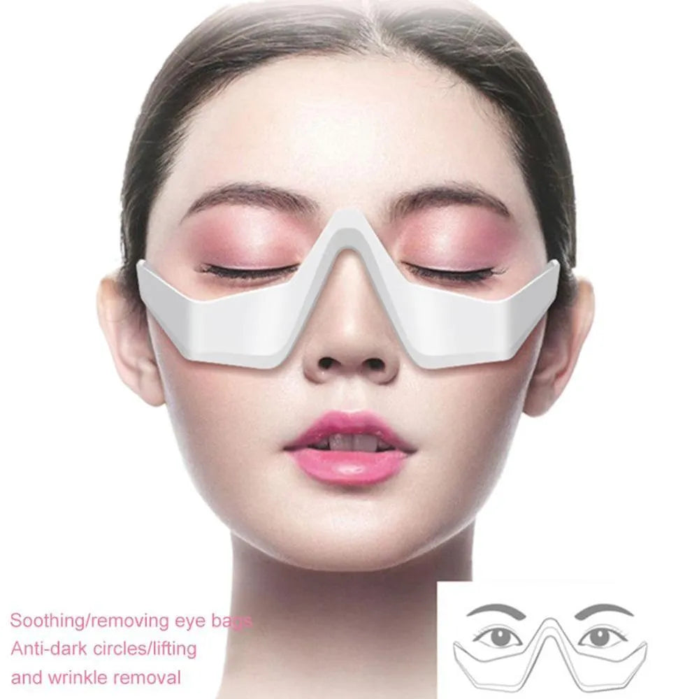 Pink and white 3D micro-current eye massager with glasses-style design on a stand.