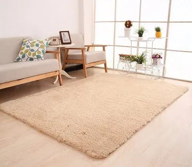 Soft white plush area rug with non-slip dot bottom on a wooden floor