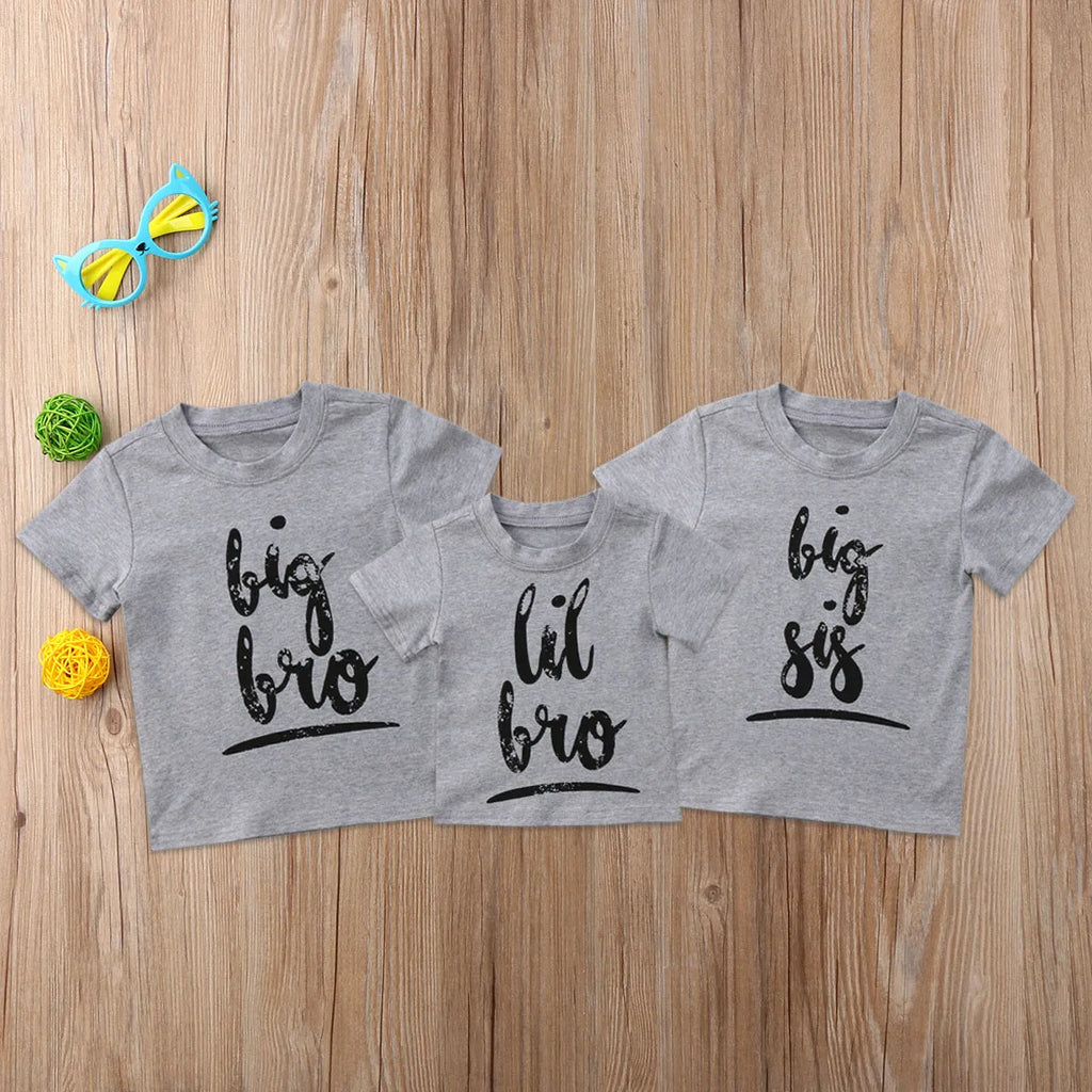 Grey kids cotton t-shirt with printed brother sister designs showing size range from 60cm to 140cm