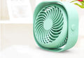 USB-powered alarm clock fan in blue with 360-degree rotating head on a desk.