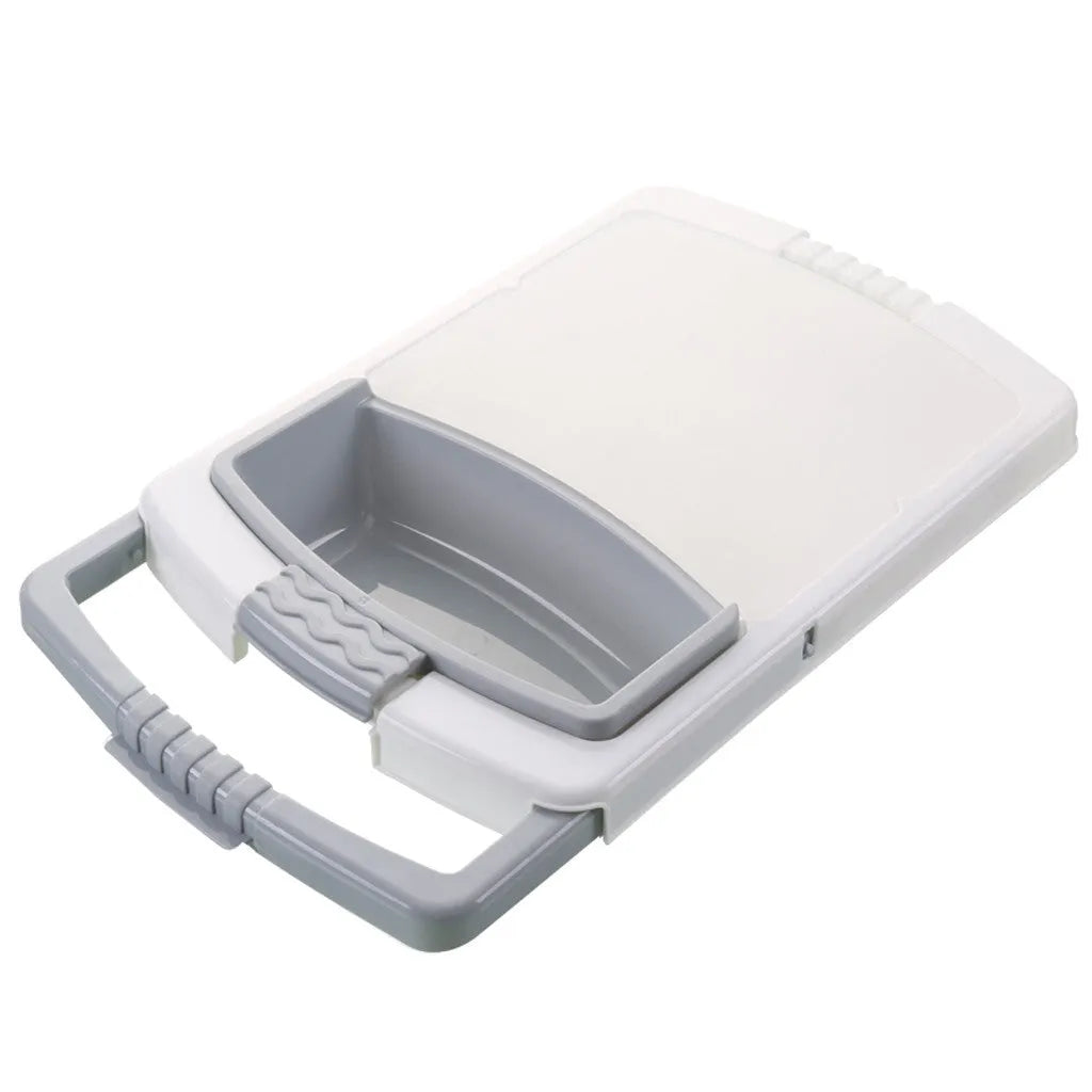 Green multi-function kitchen cutting board with drainage holes mounted on a sink edge