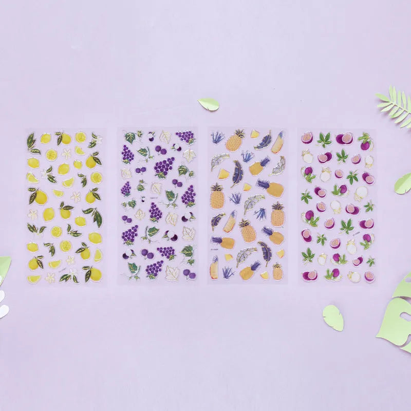 Sheet of DIY metallic gold fruit stickers including grape, orange, passion fruit, peach, pineapple, and strawberry designs.