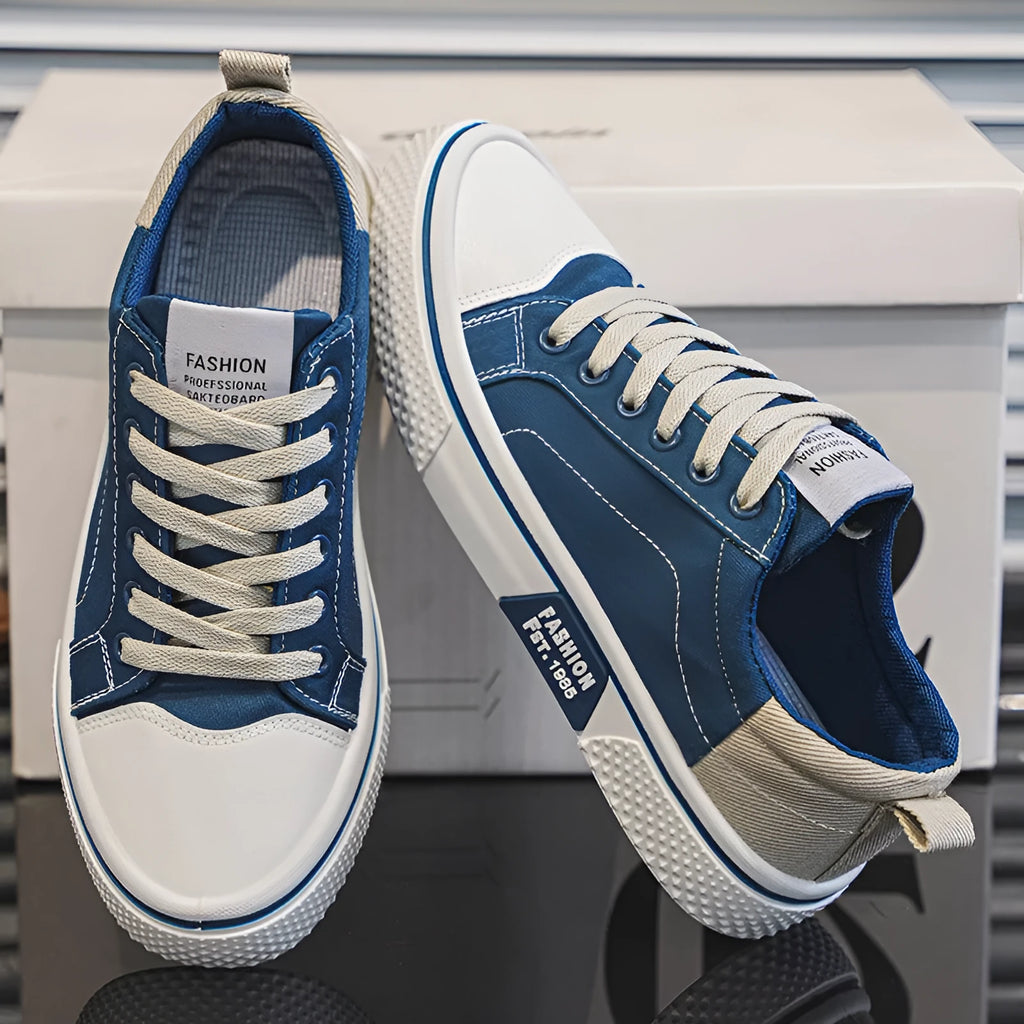 Men's low-top canvas skate shoes in blue with lace-up front and white PVC sole