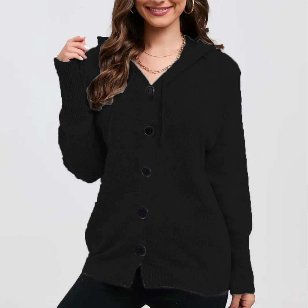 A woman wearing a loose-fit, solid-colour hooded cotton cardigan sweater.
