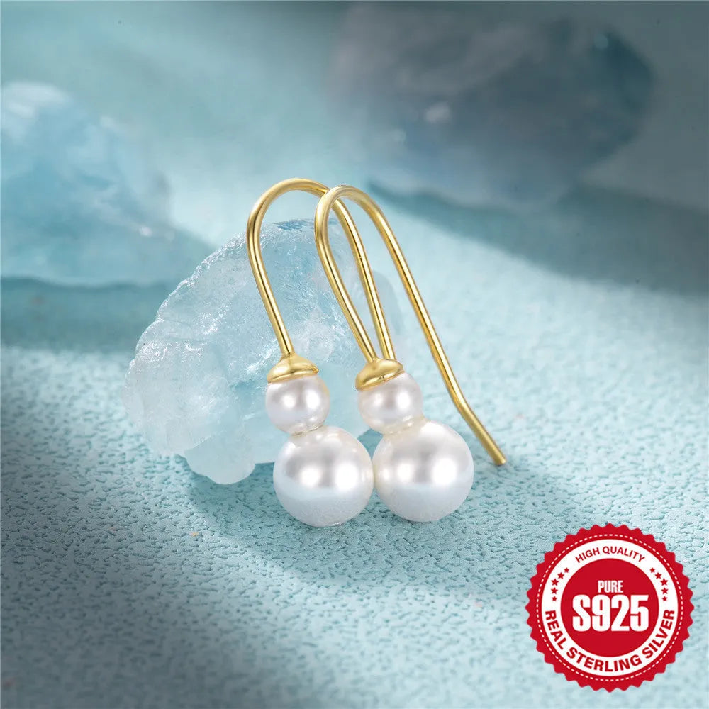 Golden S925 sterling silver earrings with geometric sunflower design and inlaid zircon stones.