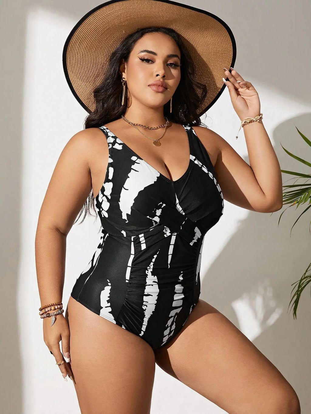 Black conservative one-piece swimsuit with sleeveless design and high-elasticity polyester construction