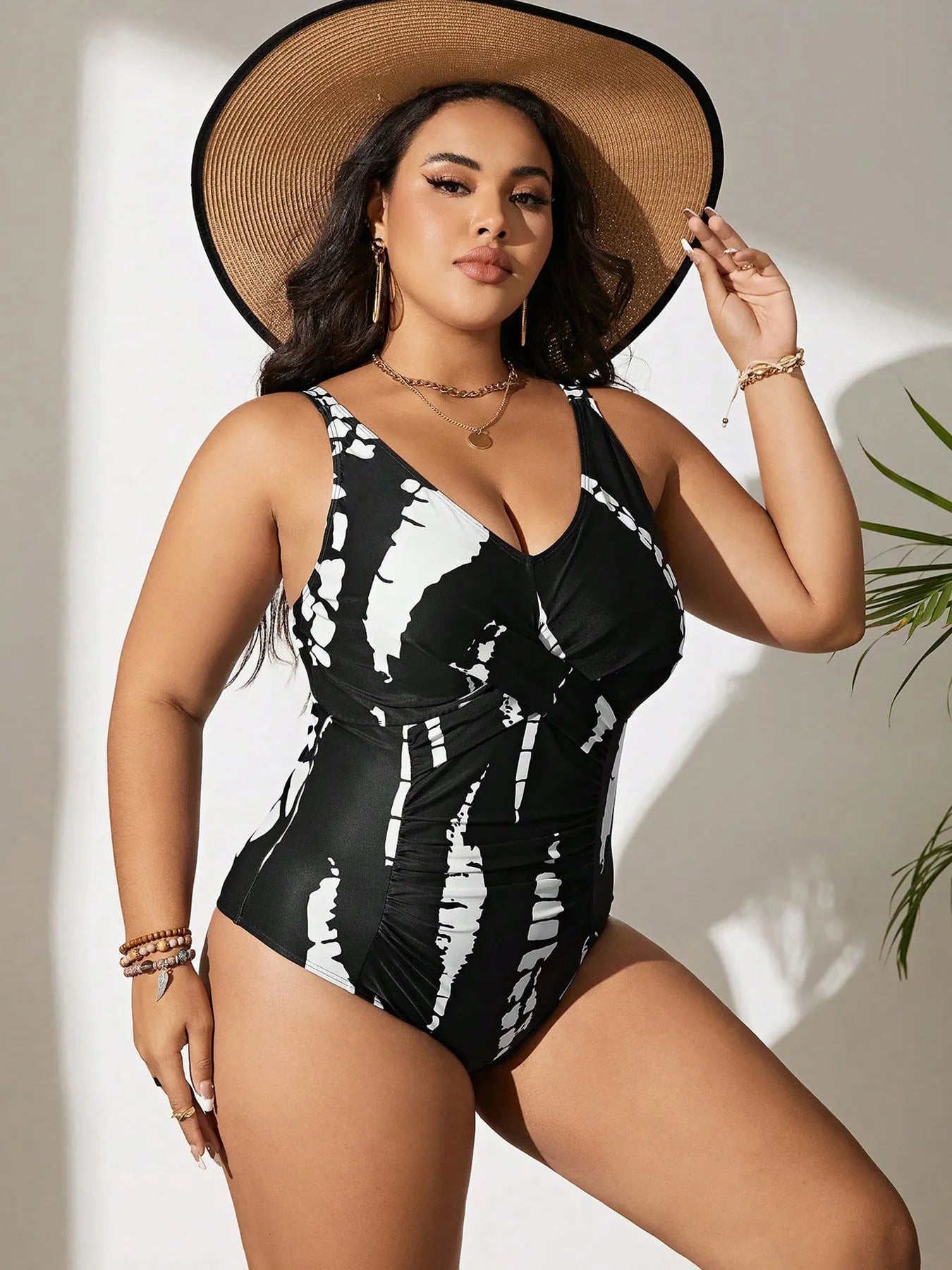 Black conservative one-piece swimsuit with sleeveless design and high-elasticity polyester construction