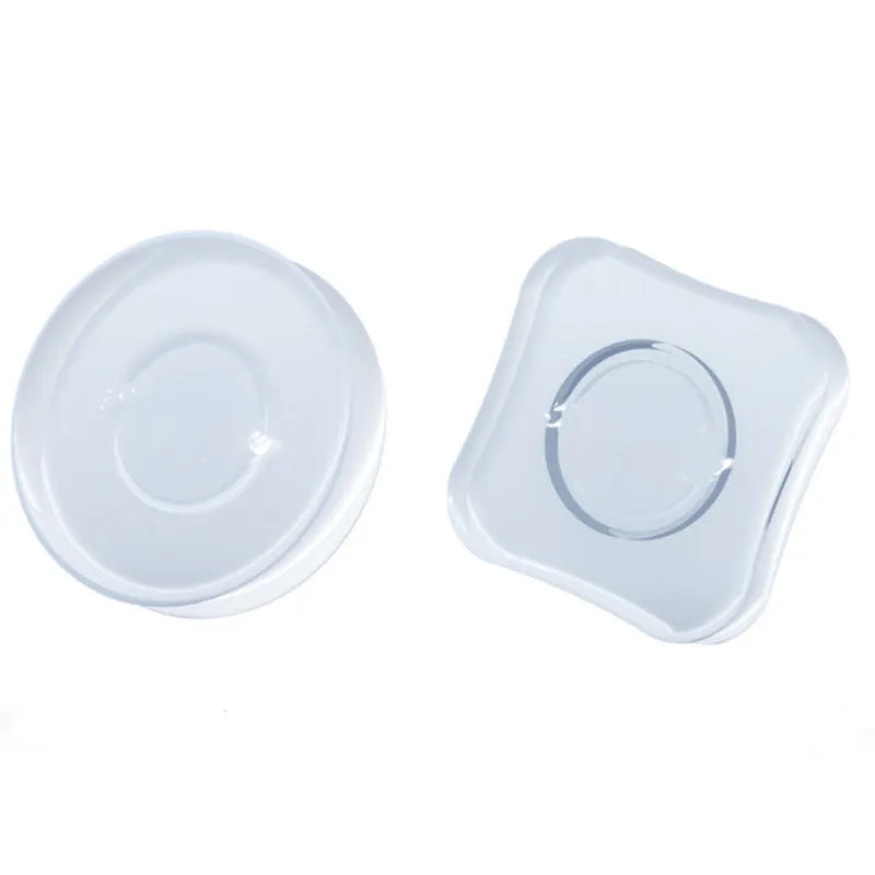 Transparent silicone nano gel adhesive pads in circle and square shapes on a dashboard.