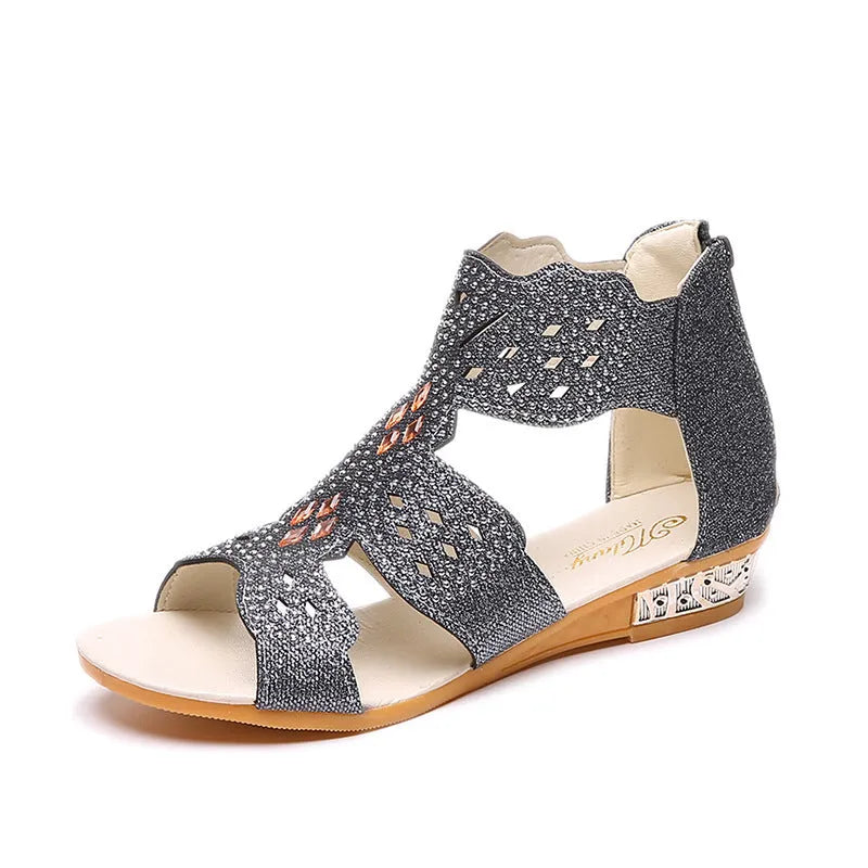 Women's flat black sandals with rhinestone details and a back zipper closure