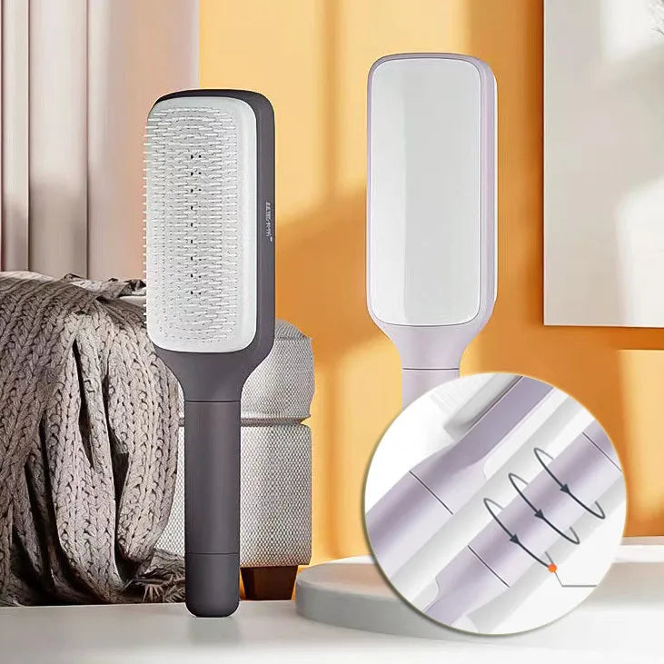 Purple self-cleaning hair brush with twist handle and massage comb teeth showing cleaning mechanism
