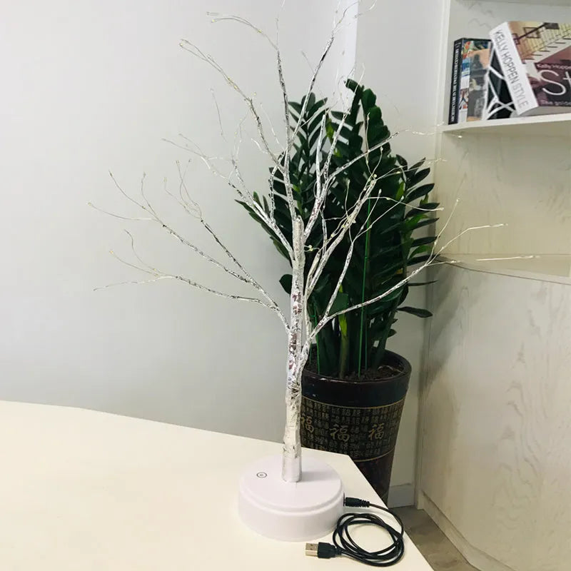 Tree light night light with bonsai-style design, warm white LED lights, adjustable branches, and USB plug.