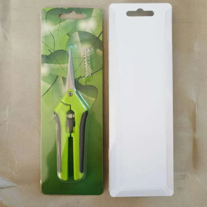 Green garden pruning scissors with stainless steel blade, 16.5 cm long, on a white background