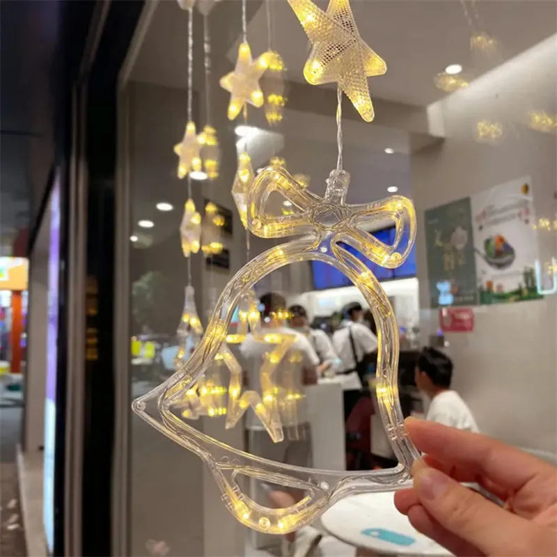 Christmas LED window decorations with suction cups showing star, tree, and deer pendant designs