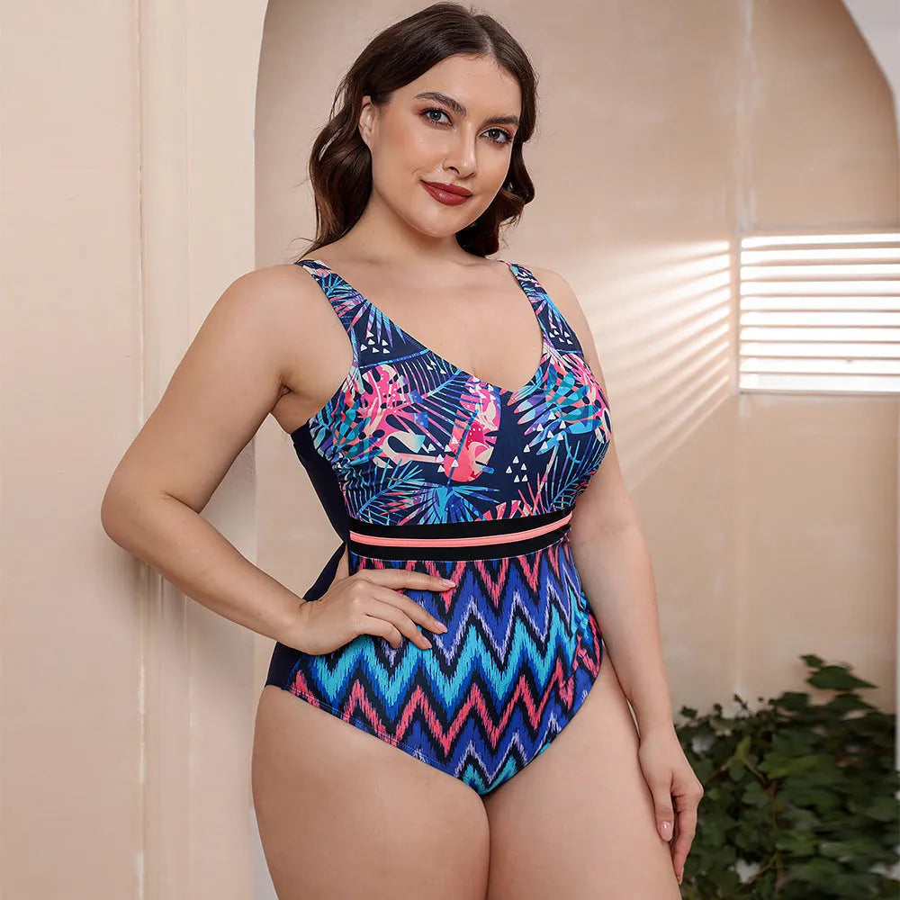 Women's blue printed one-piece swimsuit with spaghetti straps and a striped vest design.