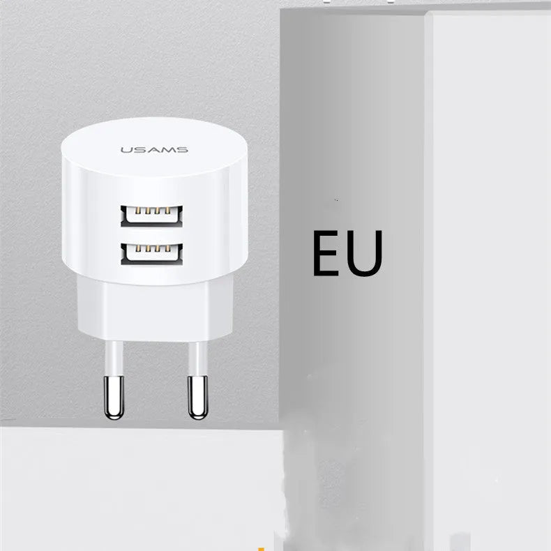 White portable universal dual USB phone charger with US, EU, and UK plug types.