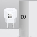 White portable universal dual USB phone charger with US, EU, and UK plug types.