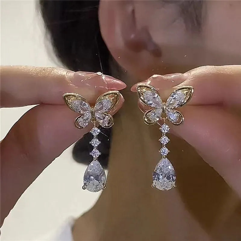 Bow-shaped zinc alloy stud earrings with electroplated platinum finish