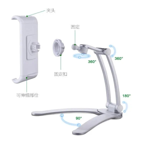 Silver aluminium alloy desktop stand holding a tablet at an angle, with adjustable clips and a white mounting base.