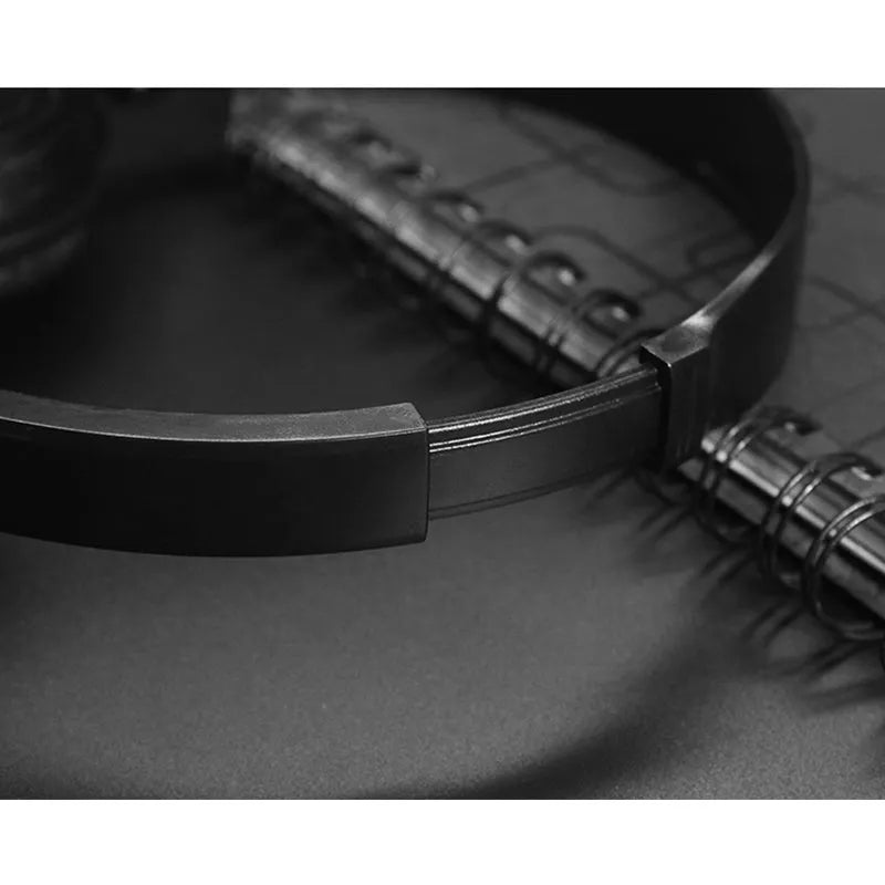Black foldable wired over-ear headphones with an adjustable headband and a 3.5mm plug.