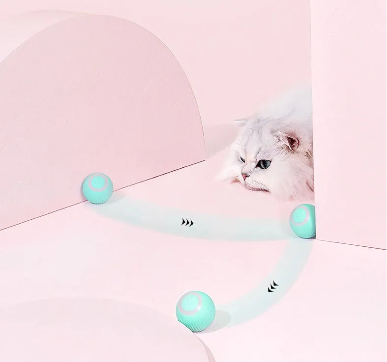 Green automatic rotating ball cat toy with intelligent obstacle avoidance, shown on a hard floor.